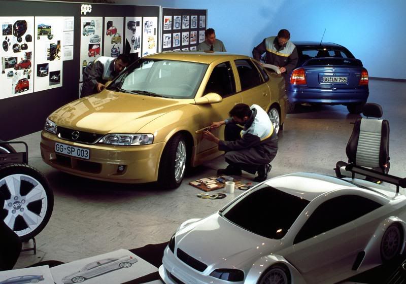 The OPC design team working on a Vectra B Note the Astra G behind it