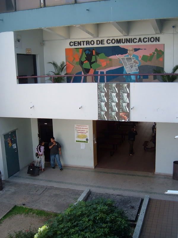 Juan Carlos Rodriguez (surveillance camera corner left and wall hanging banner)